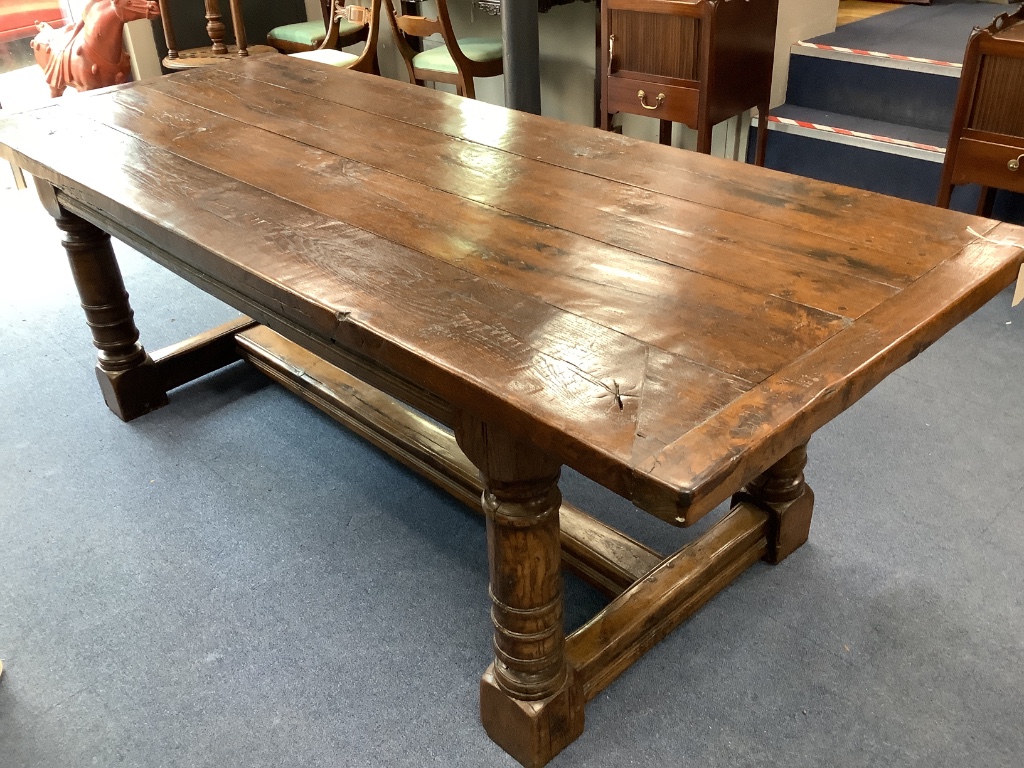 An 18th century style rectangular oak refectory dining table, length 221cm, depth 96cm, height 76cm